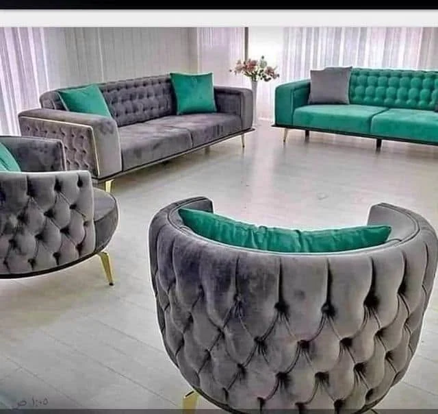 Grey tufted lounge set with teal cushions